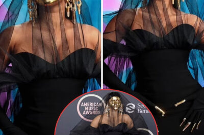 The girl with the golden mask! Cardi B is unrecognizable in face covering as she arrives on red carpet to host the 2021 American Music Awards